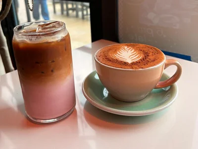 Passenger Princess specialty coffee served in a clear glass and Chai Latte served in a mug at The Greenhouse Bar in Jacksonville, Florida.